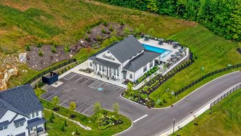 Resort style pool w/ wooded views